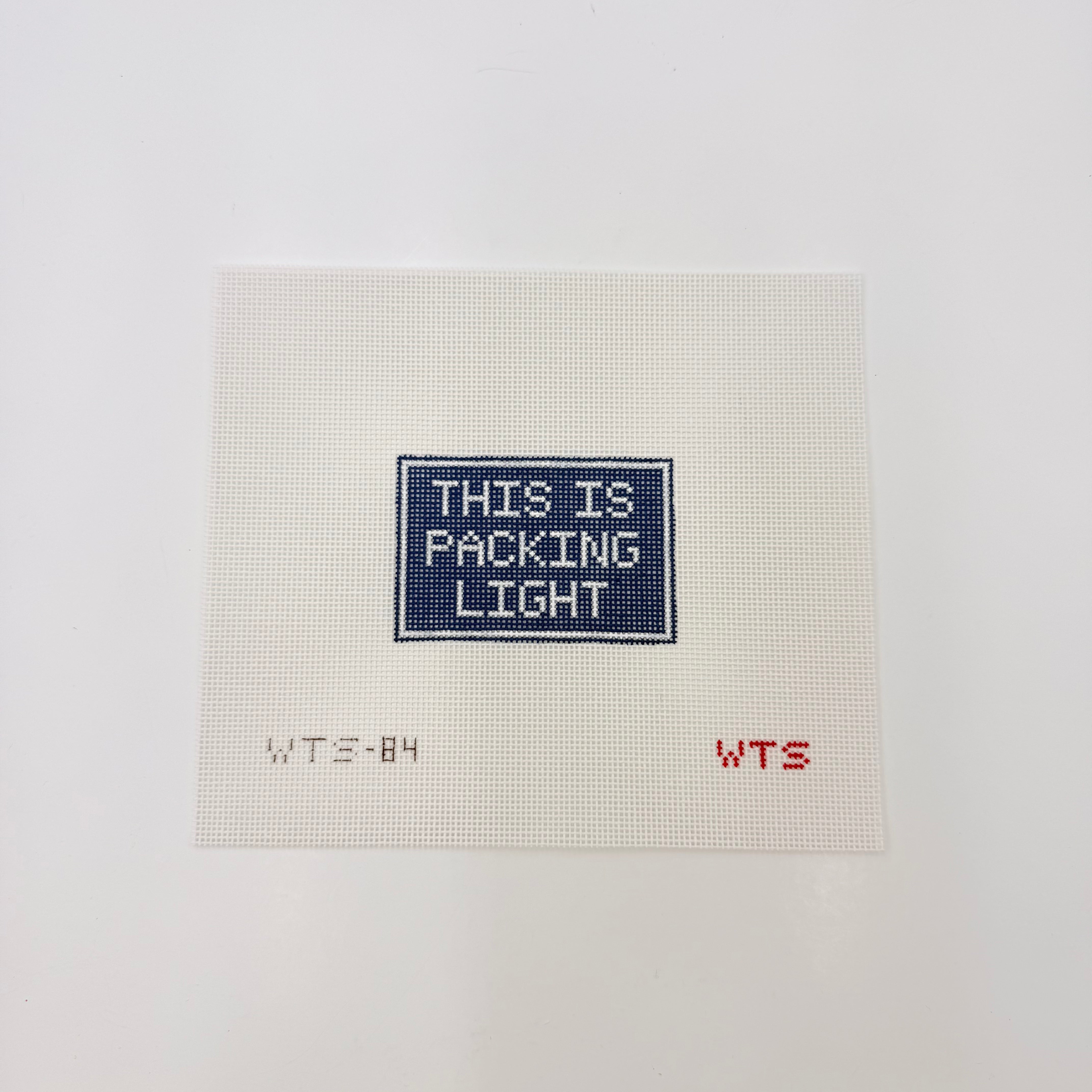 This is Packing Light Canvas - KC Needlepoint